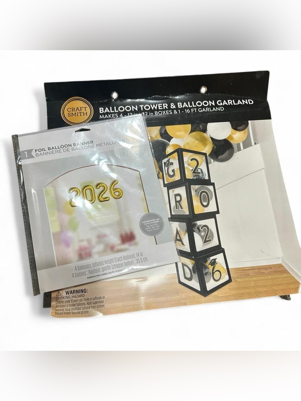 Graduation party decorations - balloon tower and banner with gold and black
